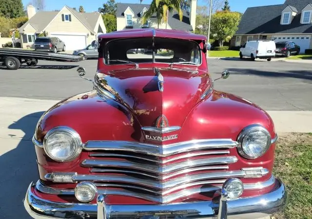 red chevy classic car transport