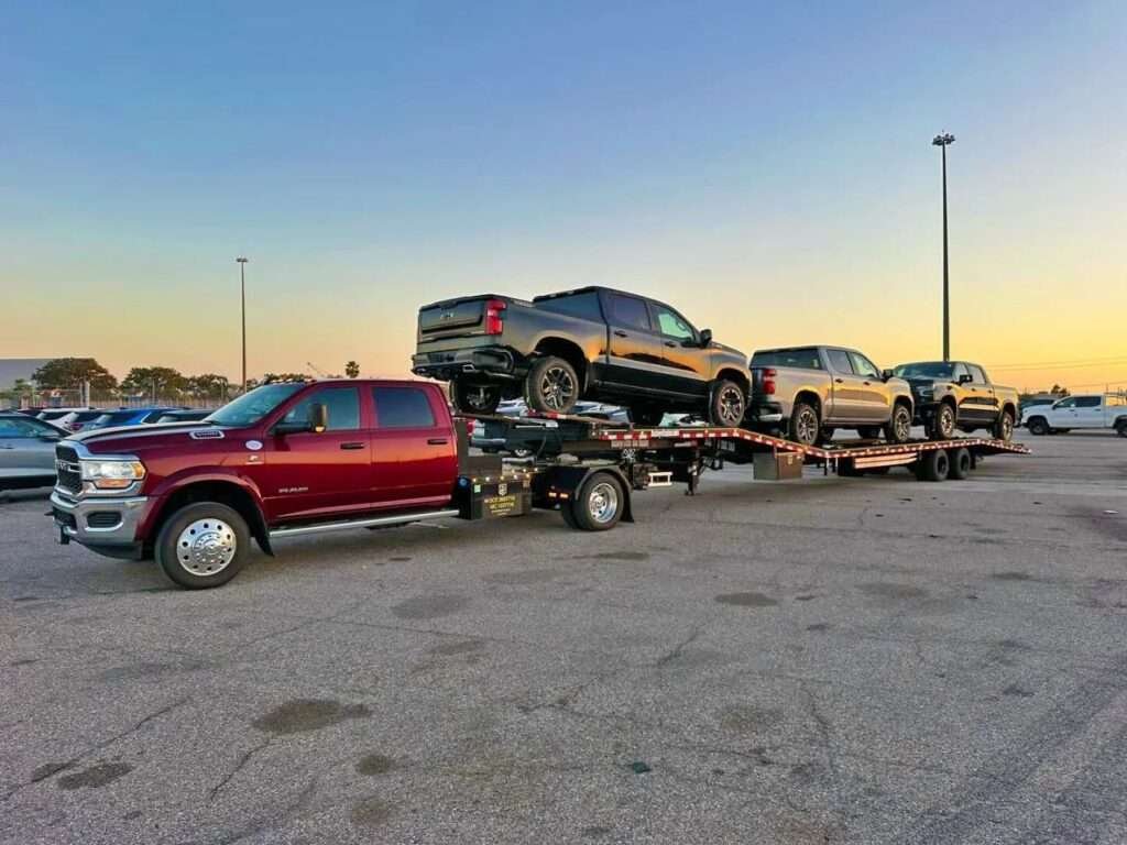 vehicle transport of cars on open trailer carrier